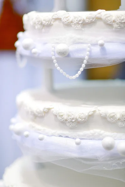 Wedding cake decorated with white lace — Stock Photo, Image