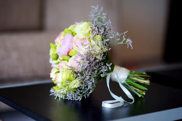 Beautiful wedding bouquet on a table — Stock Photo, Image