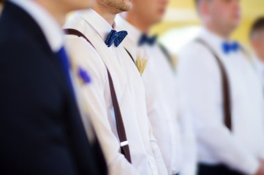 Groomsmen during wedding ceremony clipart