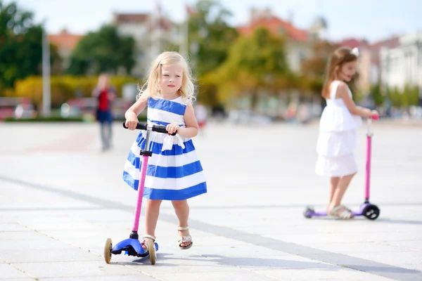 Girl riding her scooter — Stock Photo, Image