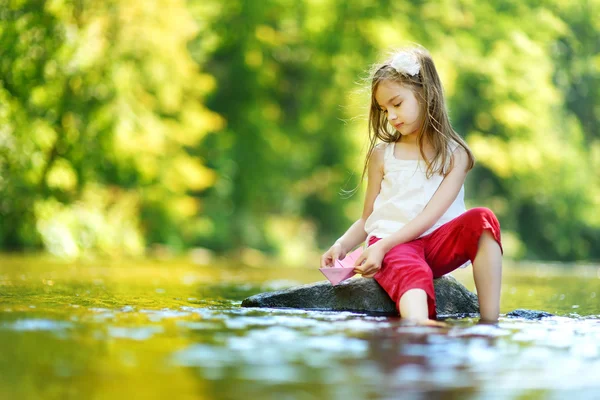 Girl having fun by a river — Stock Photo, Image