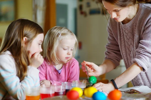 Mother and  daughters painting  Easter eggs — Stock Photo, Image
