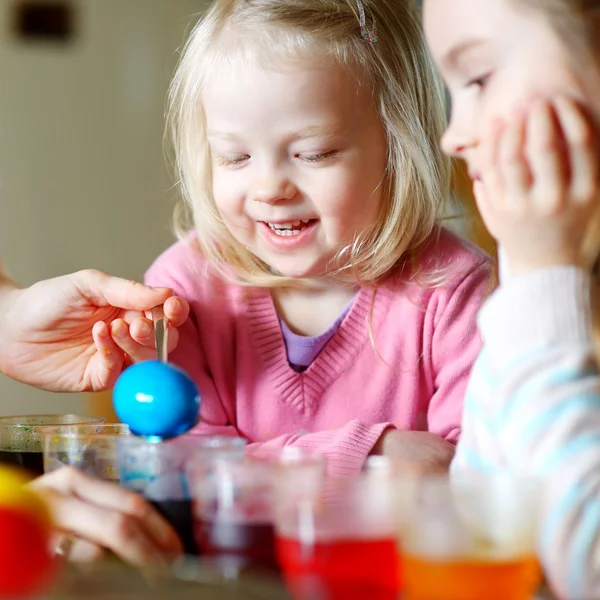 Mother and  daughters painting  Easter eggs — Stock Photo, Image