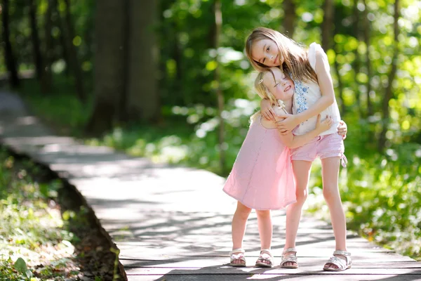 Little sisters hugging — Stock Photo, Image