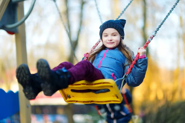 Girl having fun on a swing — Stock Photo, Image