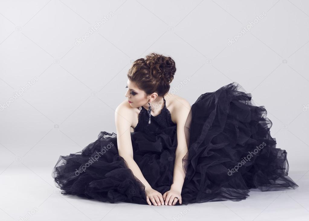 Woman in luxurious long black dress
