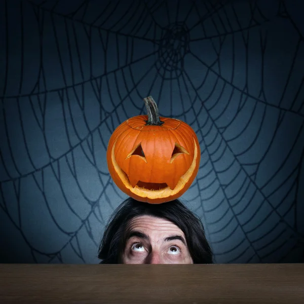 Head of the man with pumpkin — Stock Photo, Image