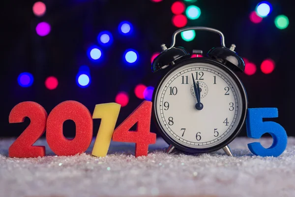 Alarm clock and 2014 and 2015 figures — Stock Photo, Image