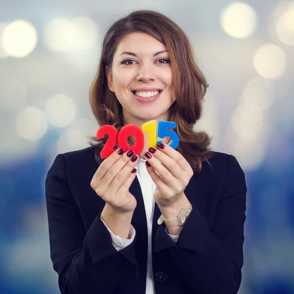 Businesswoman holding figure of 2015. — Stock Photo, Image