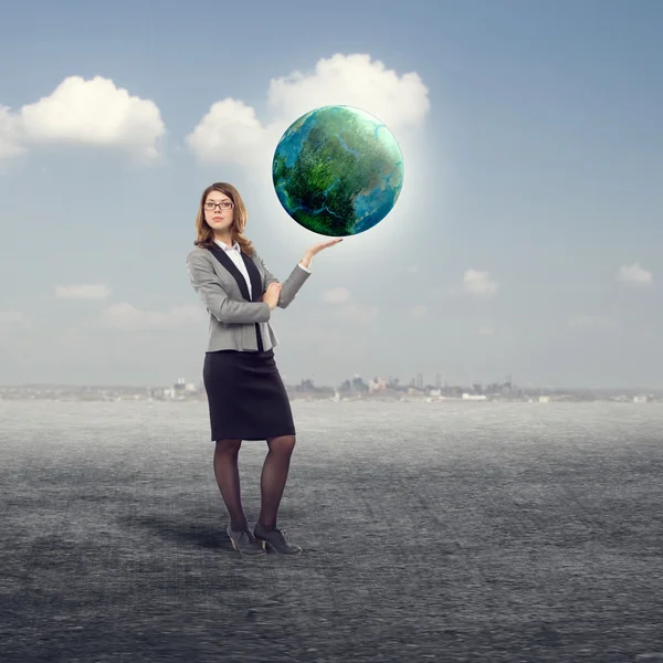 Businesswoman holding earth globe