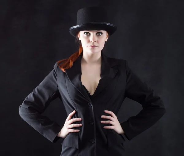 Beautiful young woman in black hat — Stock Photo, Image