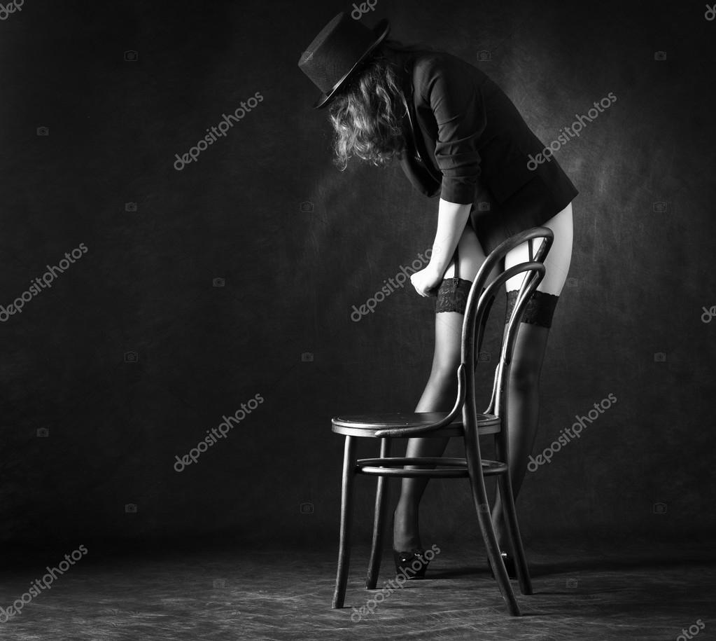 DepositphotosSexy woman dancing around chair Stock pic