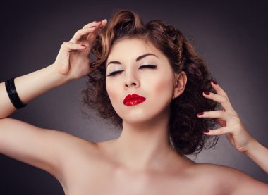 woman with red sexy lips and nails