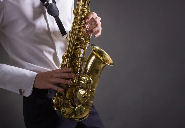 Man plays saxophone — Stock Photo, Image