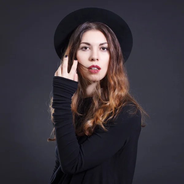 Stylish woman in black hat — Stock Photo, Image