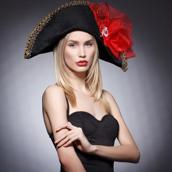 Luxury blonde young woman in a stylish black hat . — Stock Photo, Image