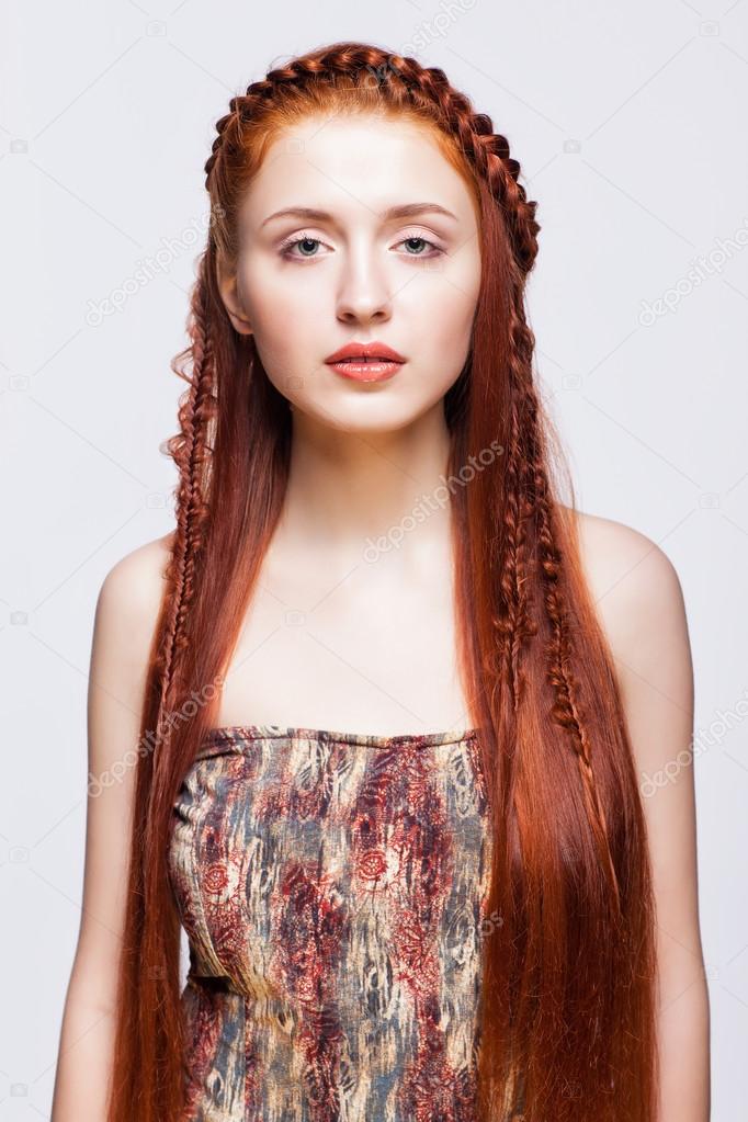 Young woman with ginger braids hairdo on white background — Stock Photo