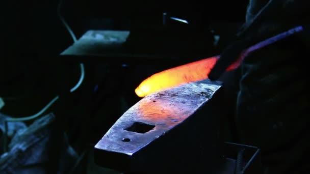 Smith hammering piece of iron — Stock Video