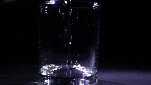 Pouring water in glass — Stock Video