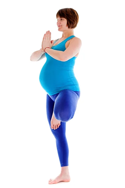Pregnant woman doing yoga — Stock Photo, Image