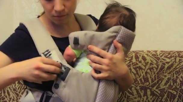 Baby in his carrier — Stock Video