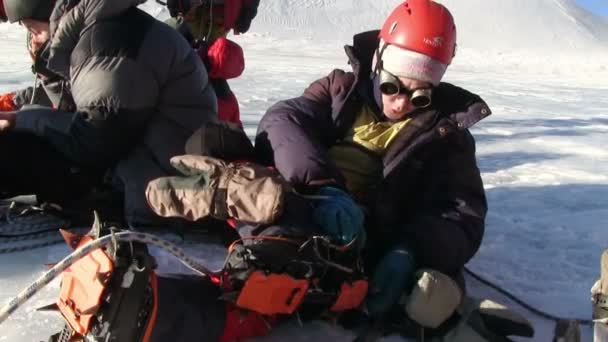 Climbers resting on a glacier before climbing — Stock Video