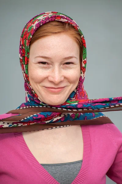 Red-haired woman with a knotted handkerchief — Stock Photo, Image