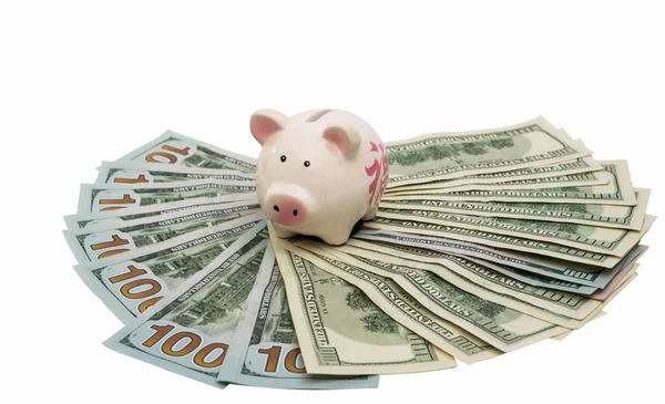 Hucha de cerdo con dólares —  Fotos de Stock