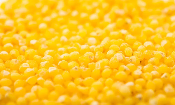 Food background - raw yellow millet groats — Stock Photo, Image