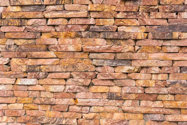 Wall of red stone tiles — Stock Photo, Image