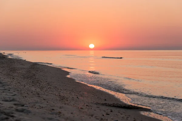 Solopgang over havet - Stock-foto