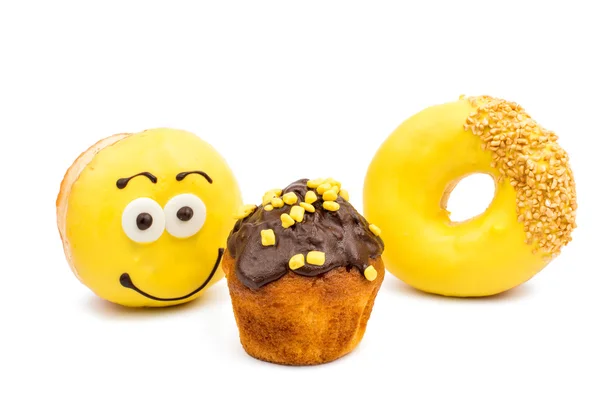 Glazed donuts and muffins — Stock Photo, Image