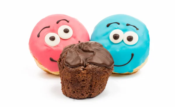 Donuts e muffins vidrados — Fotografia de Stock
