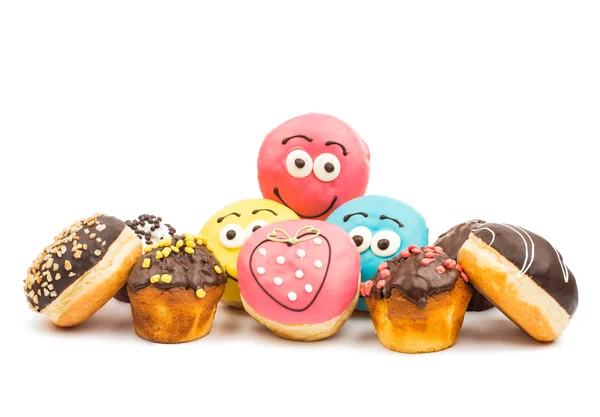 Donuts e muffins vidrados — Fotografia de Stock