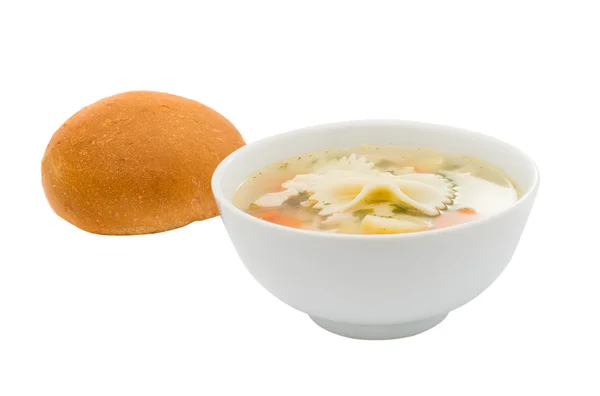 Куриный суп с булочкой — стоковое фото