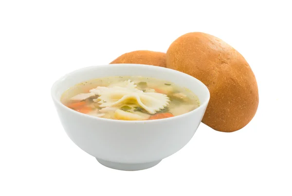 Куриный суп с булочкой — стоковое фото