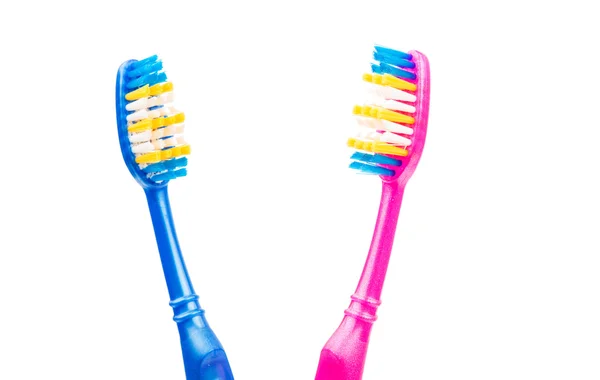 Pink and blue toothbrushes — Stock Photo, Image