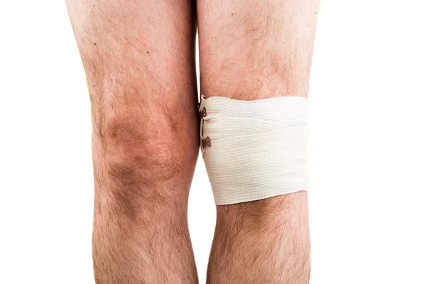 Man with elastic bandage on knee — Stock Photo, Image