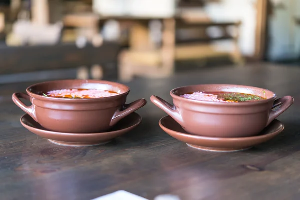 Soup with sour cream in a clay pot — Stock Photo, Image