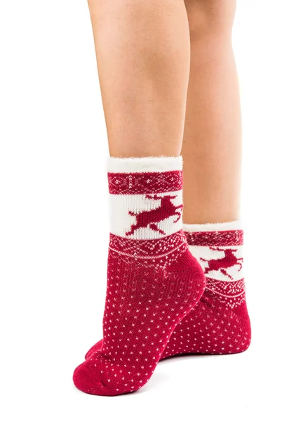 Benen lang vrouwelijke in gestreepte sokken geïsoleerd — Stockfoto