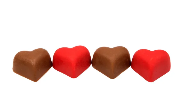 Chocolate caramelo corazones rojo — Foto de Stock