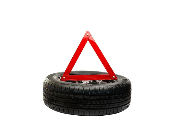 Automotive wheel with an emergency sign — Stock Photo, Image