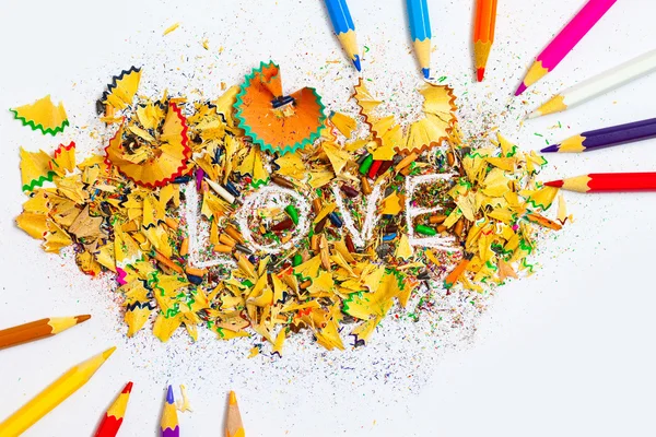The word LOVE on the background from pencil shavings