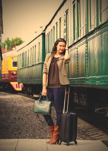 beautiful middle-aged woman with luggage