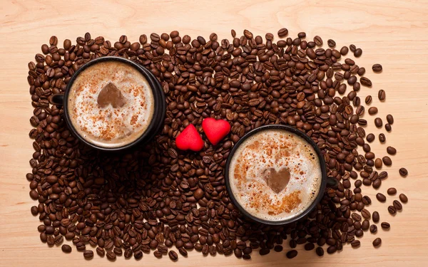 Two coffee cups and two heart — Stock Photo, Image