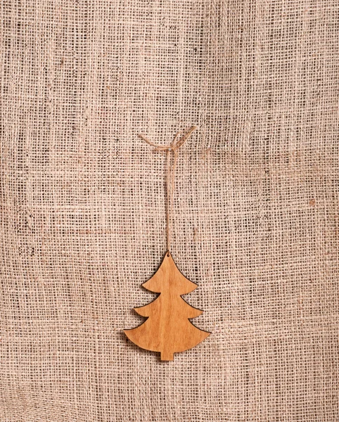 Christmas tree on burlap background — Stock Photo, Image