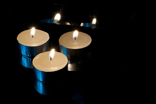 Candles on black background — Stock Photo, Image