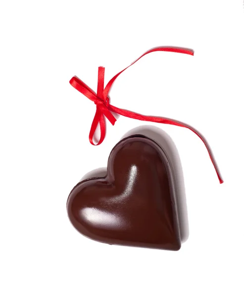 Chocolate heart and red riibbon — Stock Photo, Image