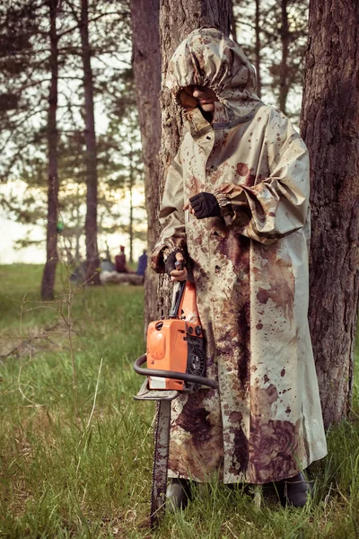 Smoking maniac with the chainsaw — Stock Photo, Image