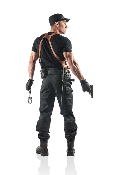 Polizist mit Handschellen und Pistole. isoliert auf weiß. — Stockfoto